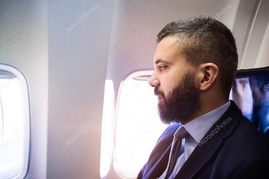 Businessman traveling in airplane