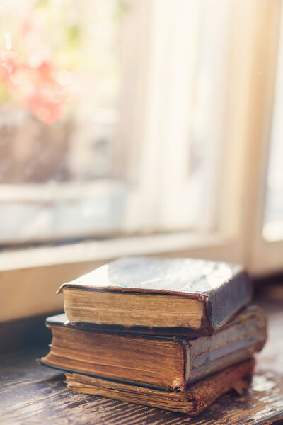 Old books on windowsill