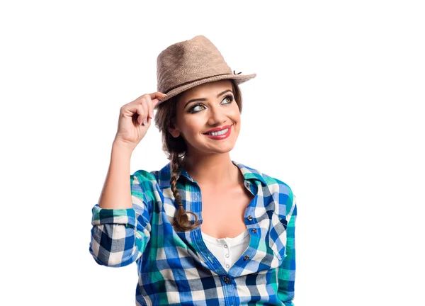 Woman with plait in blue and green checked shirt smiling — Stock Photo, Image