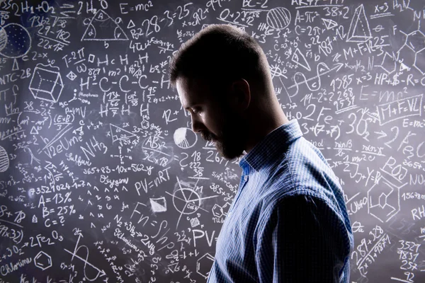 Teacher silhouette against big blackboard with mathematical symb — Φωτογραφία Αρχείου