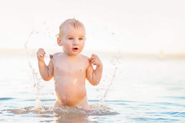 Little boy in the water on sunny summer day — Stock Photo, Image