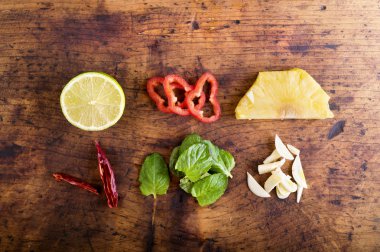 Various types of fruit and vegetables laid on table.