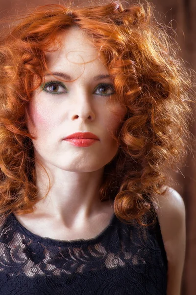 Portrait of beautiful woman with long curly red. — Stock Photo, Image