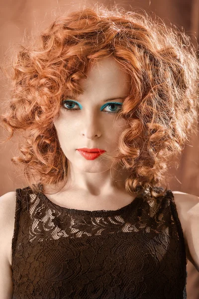 Portrait of beautiful woman with long curly red. — Stock Photo, Image
