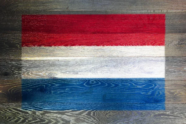 Olanda bandiera su sfondo rustico vecchia superficie di legno — Foto Stock