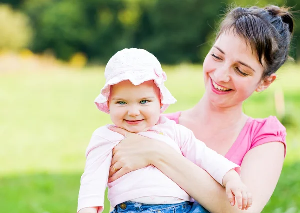 Adorable baby with her mother — Stock Photo, Image