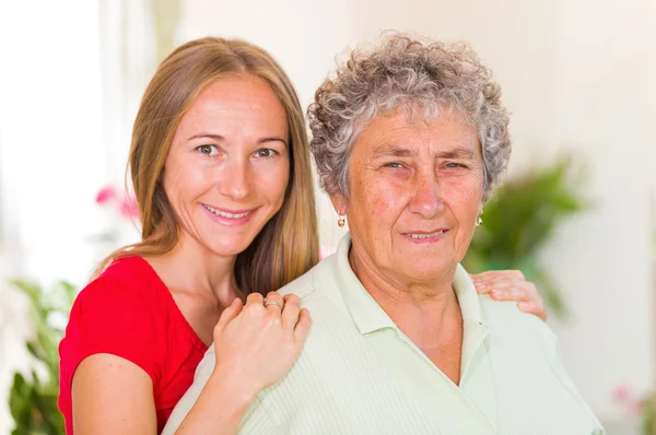 Elderly woman and her daughter — Stock Photo, Image