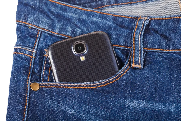 Mobile phone and blue jeans — Stock Photo, Image