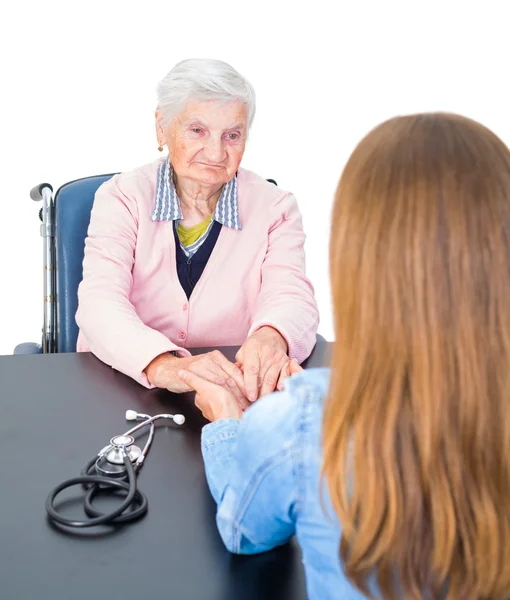 Elderly woman at the doctor — Stock Photo, Image