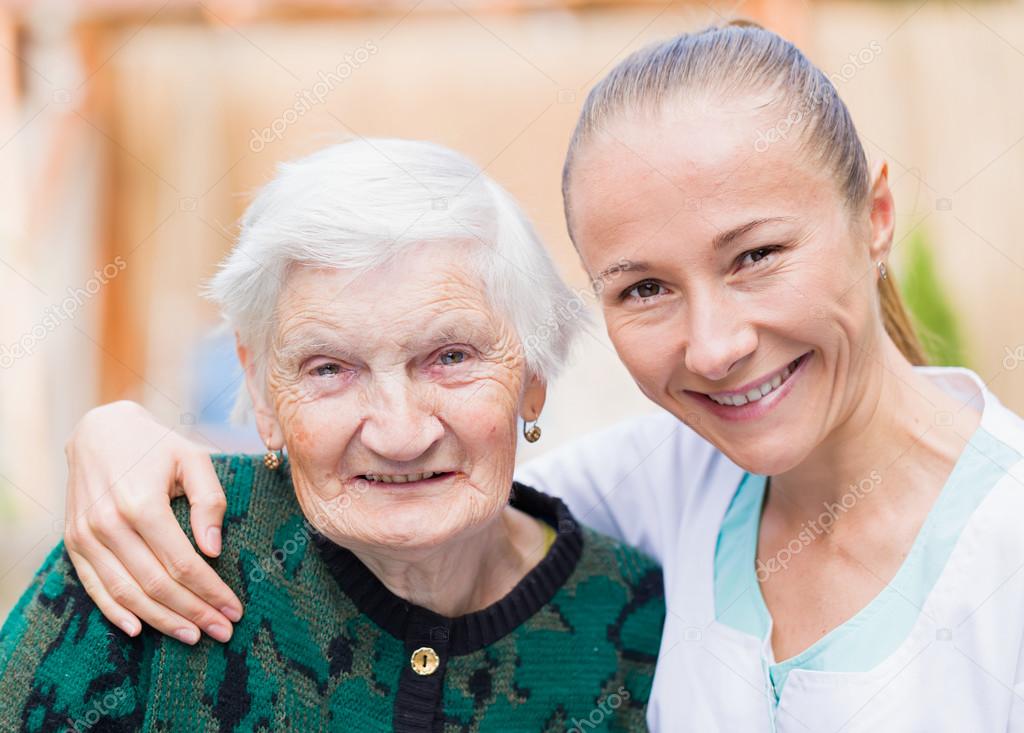 Elderly woman with caregiver