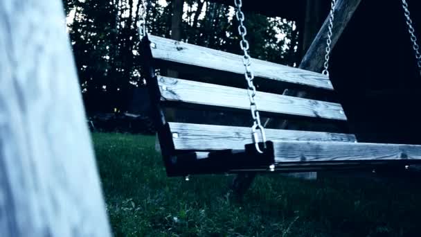 Old swing in the yard with light effect. weirdness — Stock Video