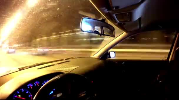 Driving a car at night in the city. Time lapse — Stock Video