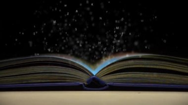 açık bir kitap uçan harfler