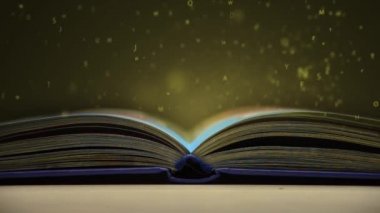 açık bir kitap uçan harfler