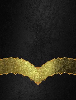 Velvet black background with a gold ornament inscription. Template for design. Abstract grunge background.