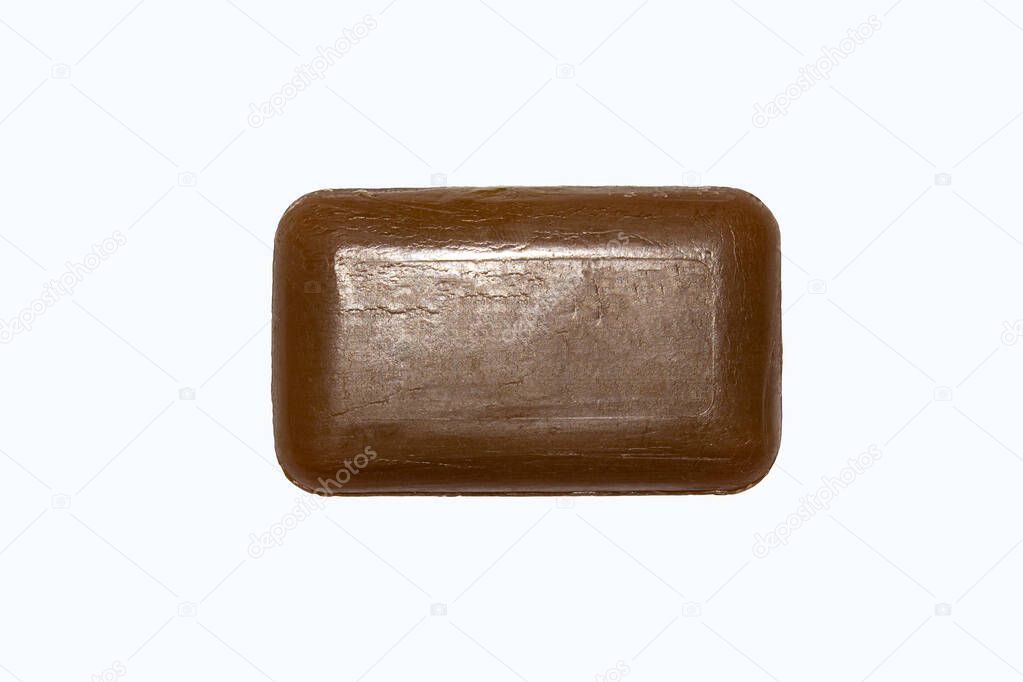 Tar soap isolated on white background.A piece of medical tar soap.