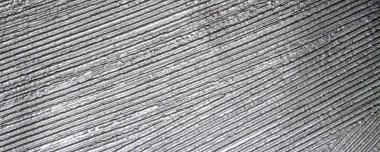 Gri flütlü alçı arka plan. Duvar gri çizgilerle kaplanmış..