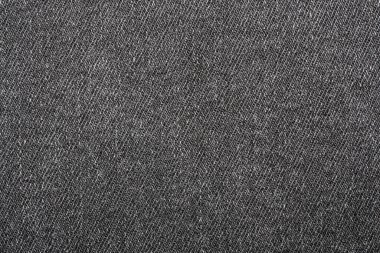 Koyu gri kumaşın dokusu çizgili flüt gibidir. Yoğun gri kumaşın arka planı.