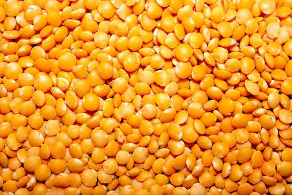 Red type of lentil.Orange lentils from the legume family top view.