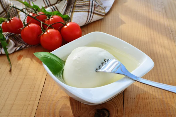 Mozzarella cheese ball on fork — Stock Photo, Image