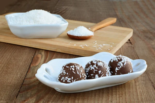 Chocolate candy with coconut topping — Stock Photo, Image