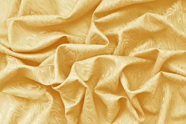 Damasco amarillo de seda dorada con textura ondulada — Foto de Stock