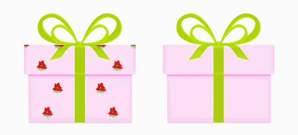 Две розовые подарочные коробки с зеленым луком и лентой одна завернута в пуансеттия узора изолированы на белом — стоковое фото