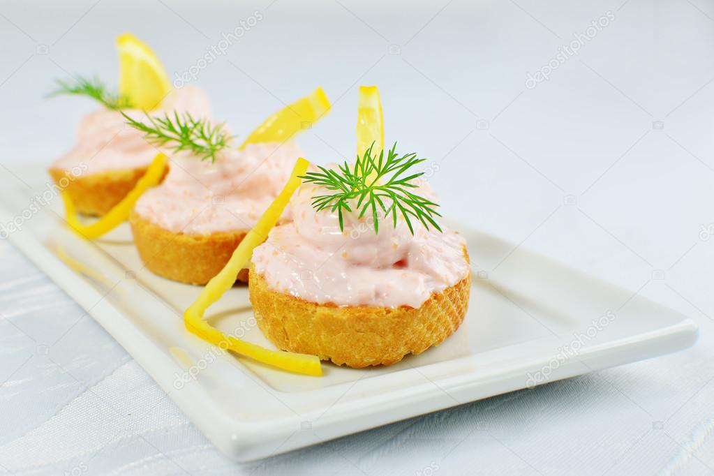 Taramasalata Canape Fish Roe Spread Bites With Lemon Slices Over Bread Stock Photo Image By C Whiteaster 99589360