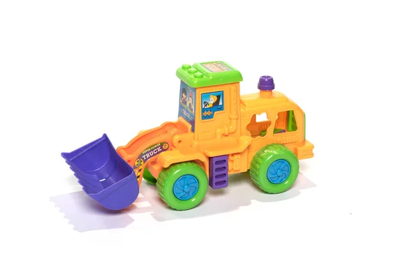 Іграшковий трактор ізольований на білому тлі . — стокове фото