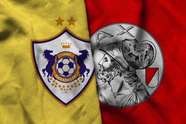 Pringsewu, Lampung; 5 Aralık 2025; Kabil ve Ajax futbol kulübü logolarının Şampiyonlar Ligi 'nde dalgalı kumaş dokusuyla kombinasyonu