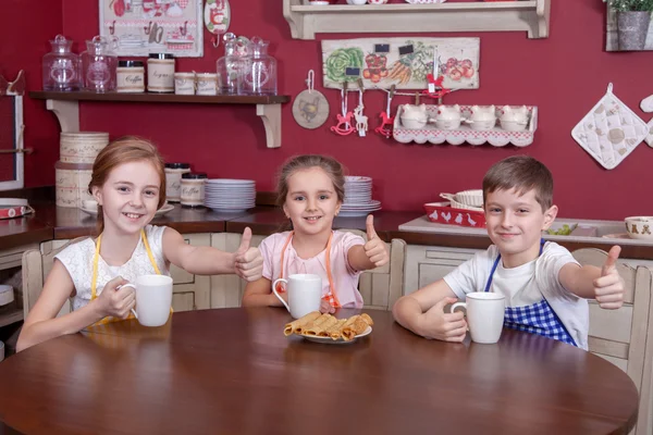 Best little friends resting in kitchen and drinking tea. — Stock Photo, Image