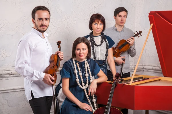 Classical music quartet posing after the concert.