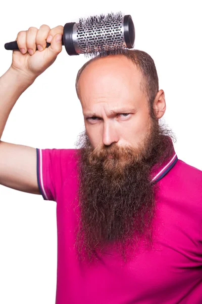 Adult unhappy man hand holding comb on bald head — Stock Photo, Image
