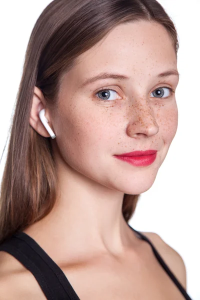 Young woman with wireless earphones — Stock Photo, Image