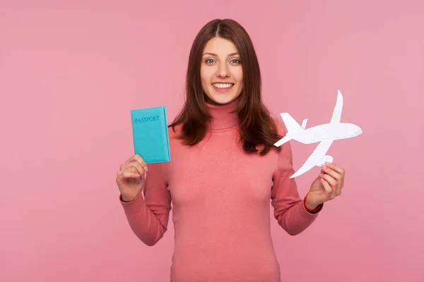 Happy Brunette Woman Pink Sweater Holding Paper Plane Model Passport — Stock Photo, Image