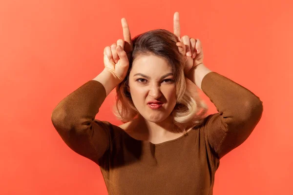 Portrait Angry Menacing Blonde Woman Brown Blouse Showing Bull Horns — Stock Photo, Image