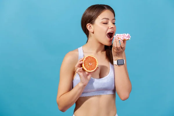 Athletic Woman Sports Top Eating Sweet Junk Donut Instead Fresh — Stock Photo, Image