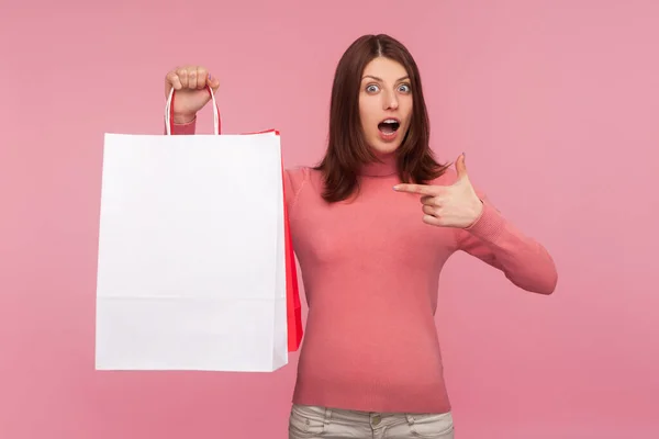 Shocked Amazed Brunette Woman Pink Sweater Pointing Finger Paper Bags — Stock Photo, Image