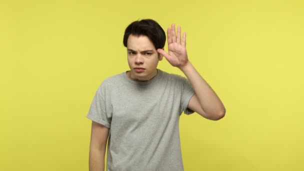 Unhappy Young Guy Gray Shirt Making Stupid Gesture Twisting Finger — Stok Video