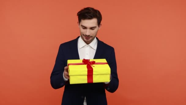Handsome Brunette Man Holding Yellow Present Box Hands Shaking Interesting — Stock Video