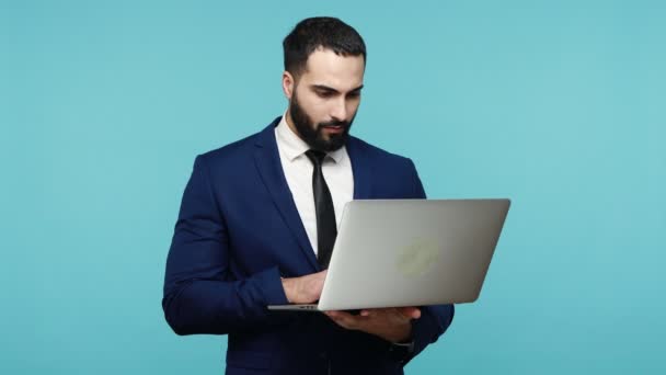 Handsome Bearded Man Holding Laptop Looking Complete Disbelief Mouth Open — Stock Video