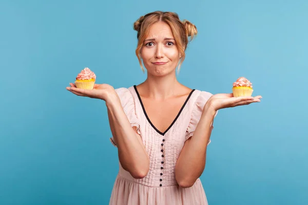 Upset Beautiful Woman Dress Holding Two Delicious Cakes Her Hands — Stock Photo, Image