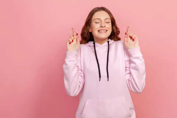 Portrait Hopeful Joyous Young Woman Curly Hair Hoodie Raising Fingers — Stock Photo, Image