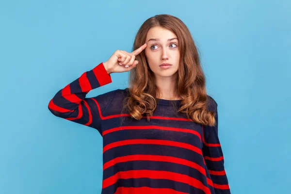 Portrait Woman Wearing Striped Casual Style Sweater Making Stupid Sign — стоковое фото