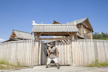 Strong real Viking outside of his home