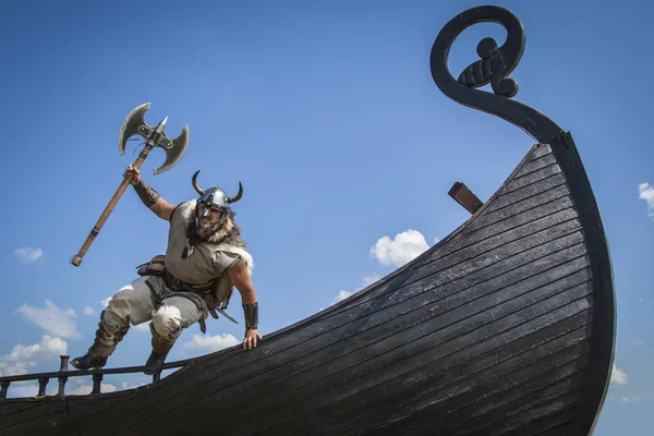 Strong Viking jumping from his ship to attack — Stock fotografie