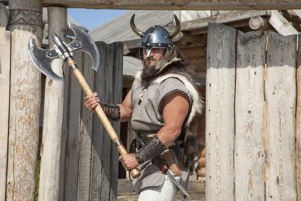 strong Viking outside his home