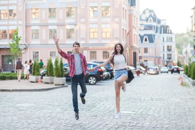 Happy young couple laughing in the city. Love Story series.
