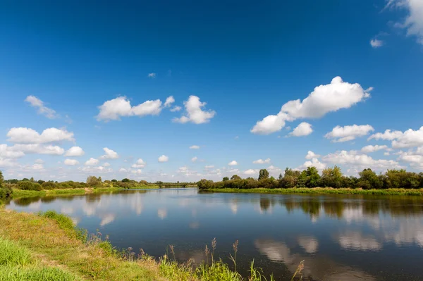 River with reflection of clouds — Stock Photo, Image