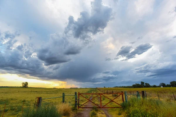 Countryside gate Stormy with a stormy sky in the background, La